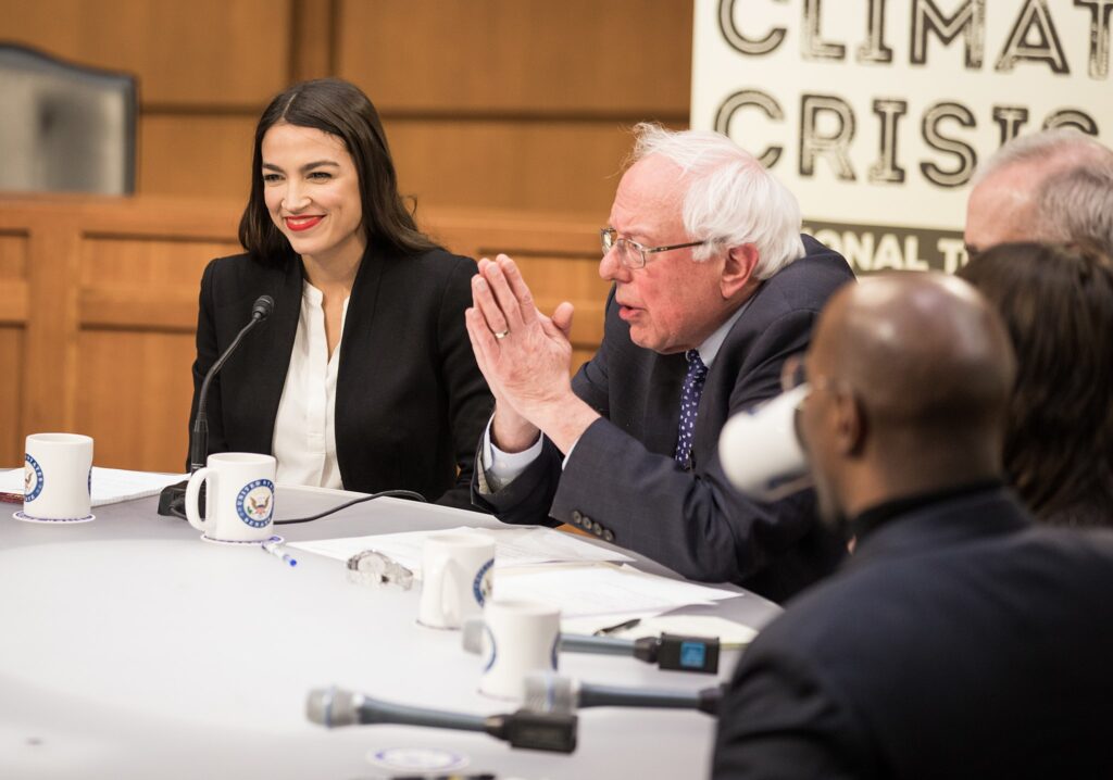Alexandria Ocasio-Cortez and Bernie Sanders, two of America's most prominent socialist figures right now.