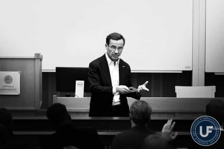 Swedish Prime Minister Ulf Kristersson giving a lecture at Uppsala University.