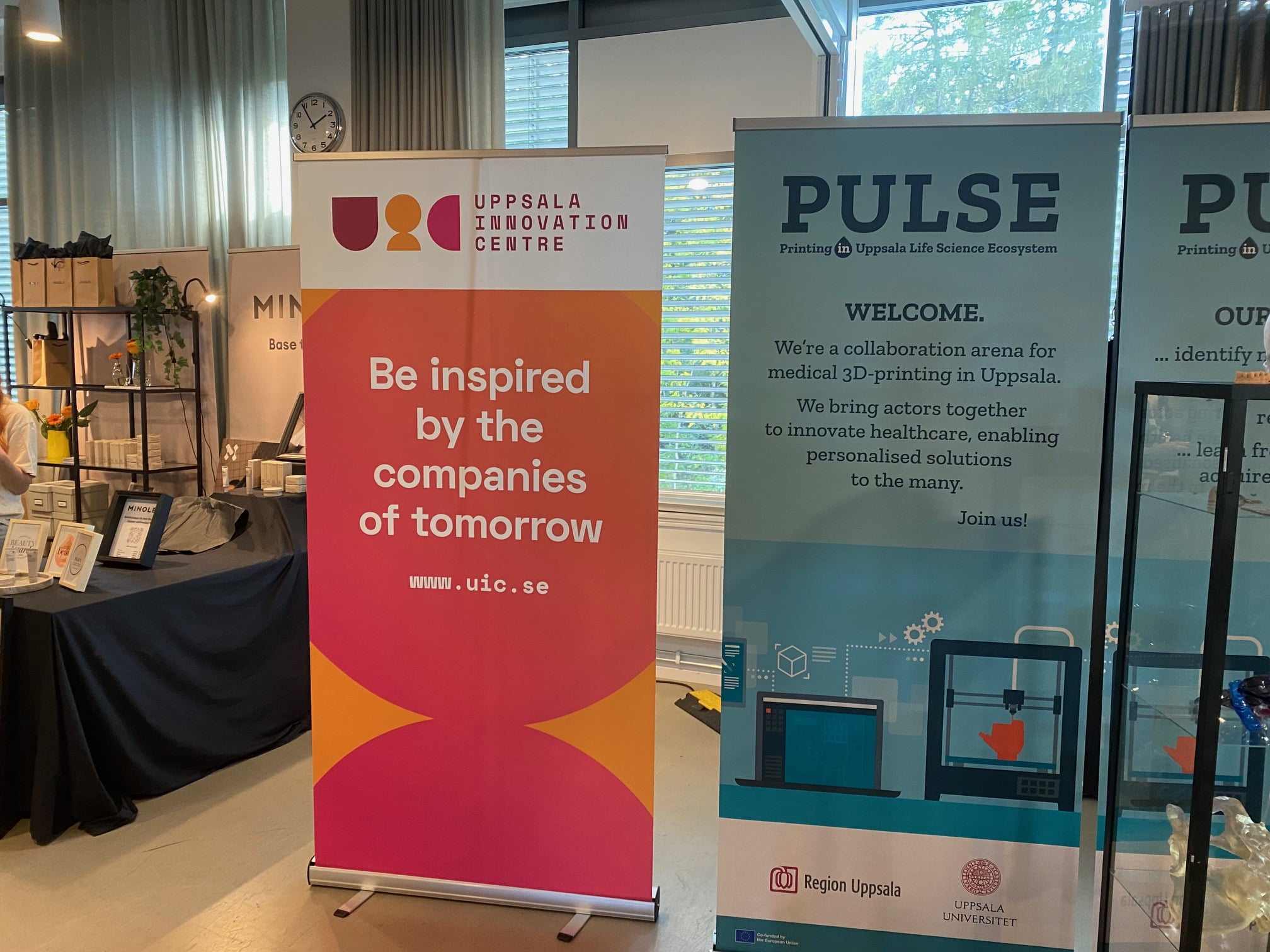 Two banners, one showcasing Uppsala Innovation Day, the other a 3D printing company called Pulse.