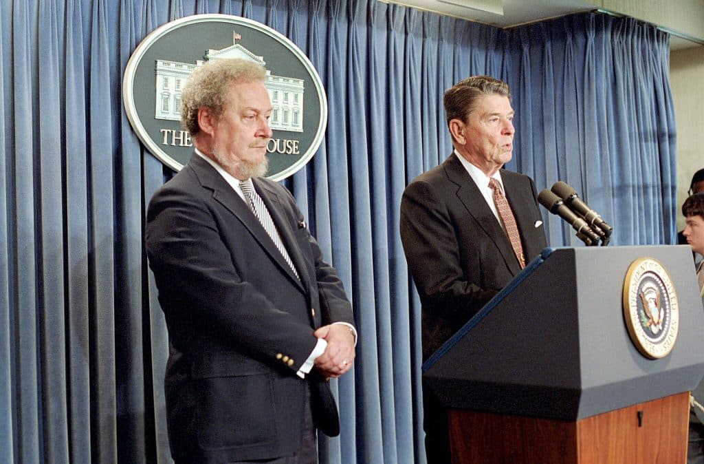 Ronald Reagan speaks at a press conference announcing his nomination of Robert Bork, who stands to his left, to the Supreme Court.