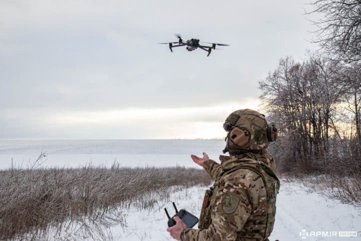 A member of the Ukrainian armed forces flying a drone.