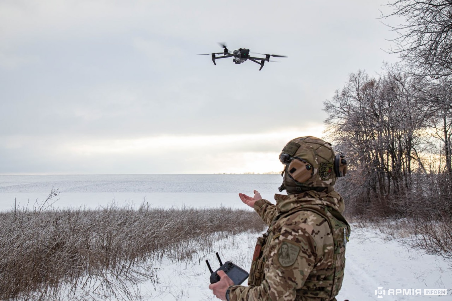 A member of the Ukrainian armed forces flying a drone.
