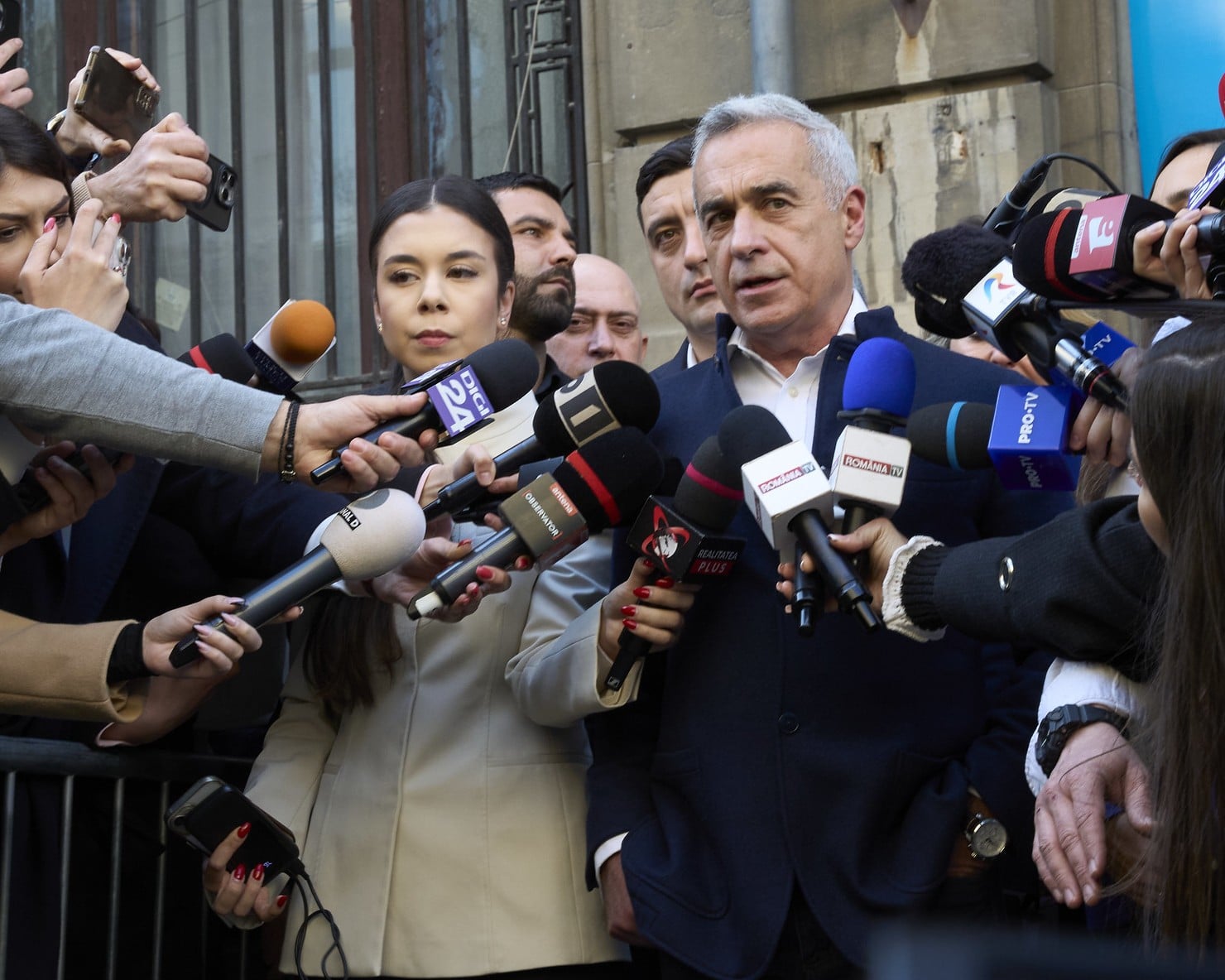 Călin Georgescu speaking to reporters.