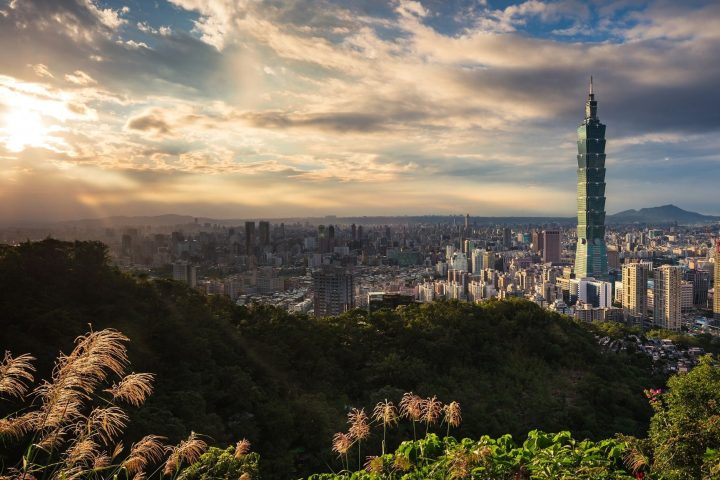 Green hills and skyscrapers in Taipei.