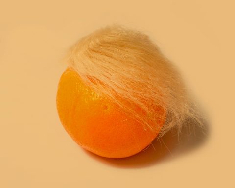 An orange with blond hair.
