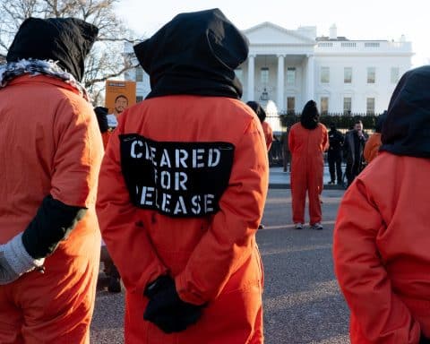 Protestors dressed as prisoners from Guantanamo Bay, outside the White House.