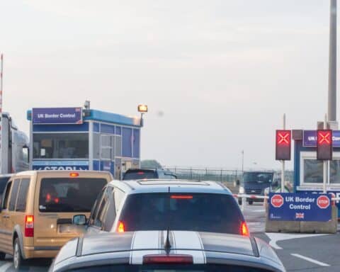 Cars queuing in front of the British border control area in Dunkerque.