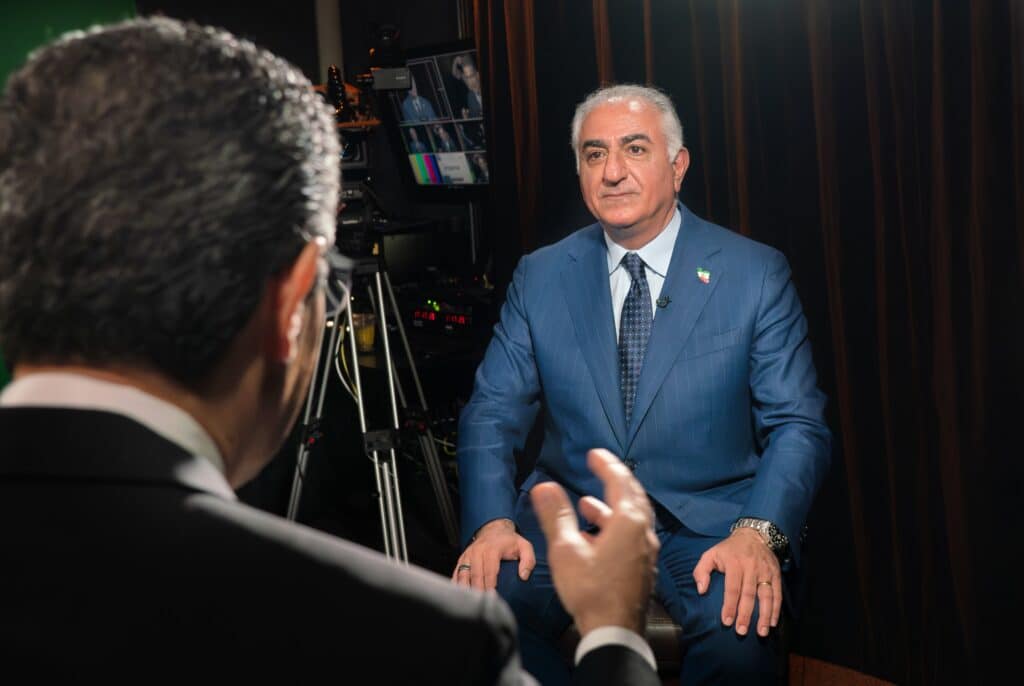 Reza Pahlavi sitting for an interview.